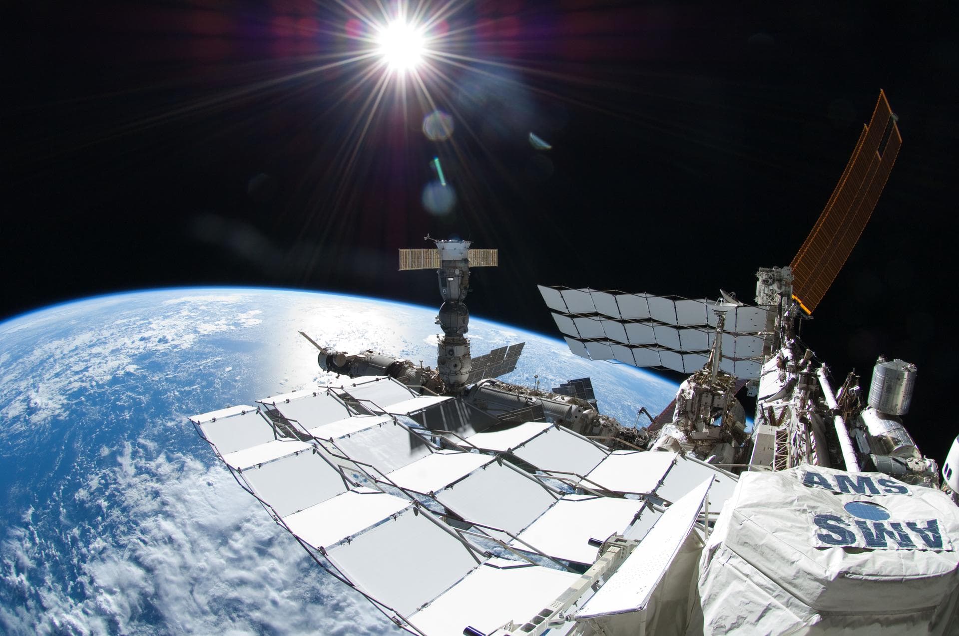 iss028e016135 (7/12/2011) --- Exterior view of the International Space Station (ISS) taken during a session of Extravehicular Activity (EVA) with a fisheye camera. The Alpha Magnetic Spectrometer - 2