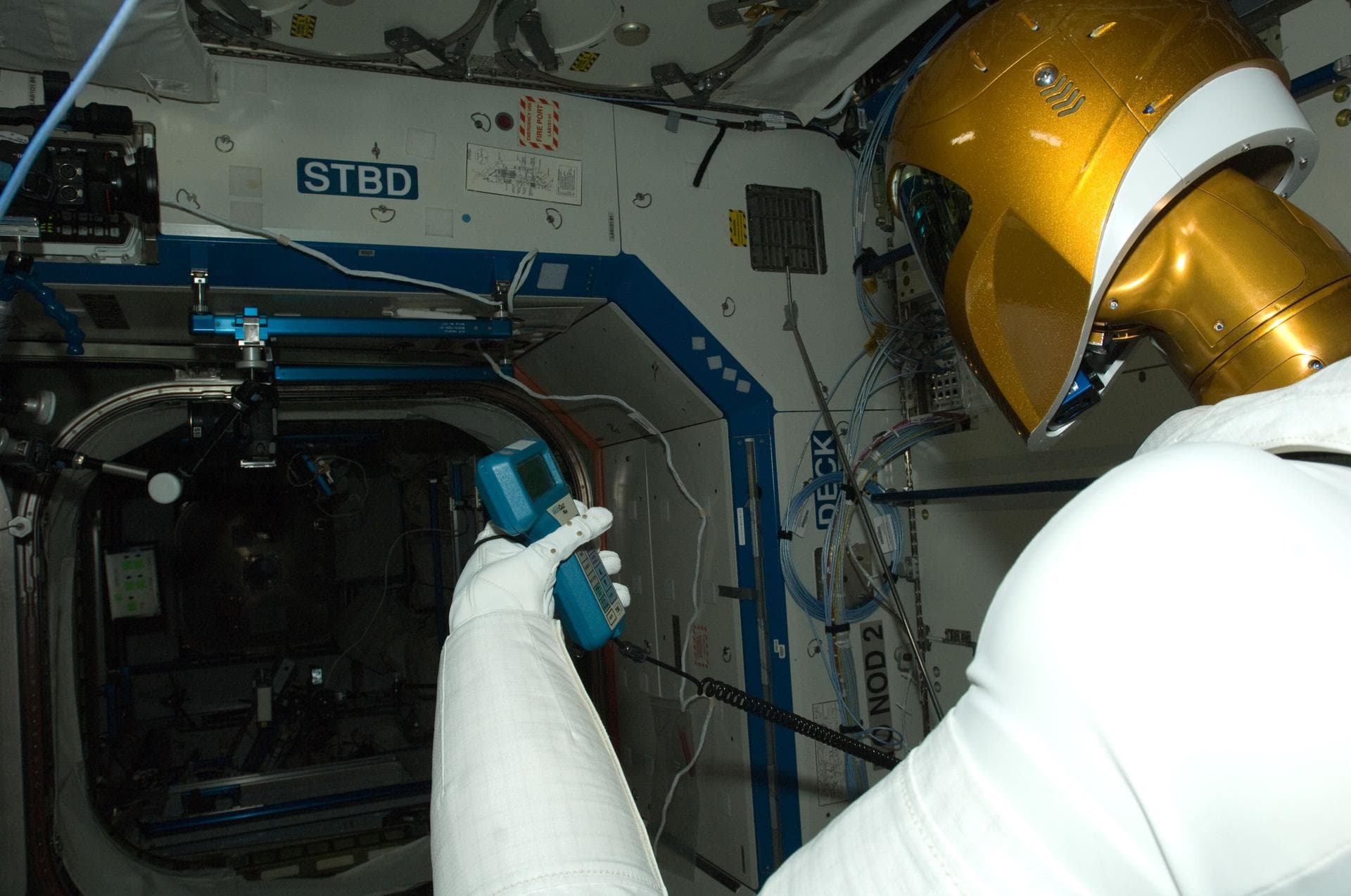 ISS030-E-142876 (14 March 2012) --- Controlled by teams on the ground, Robonaut 2 humanoid robot holds an instrument to measure air velocity during another system check out in the Destiny laboratory o