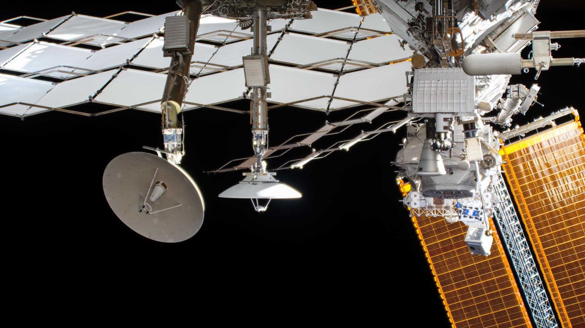 iss055e024025 (4/15/2018) - View of a radiator pane, solar array and the Alpha Magnetic Spectrometer - 02 (AMS-02) as seen by the External High Definition Camera (EHDC1). Also visible are Neutron Star