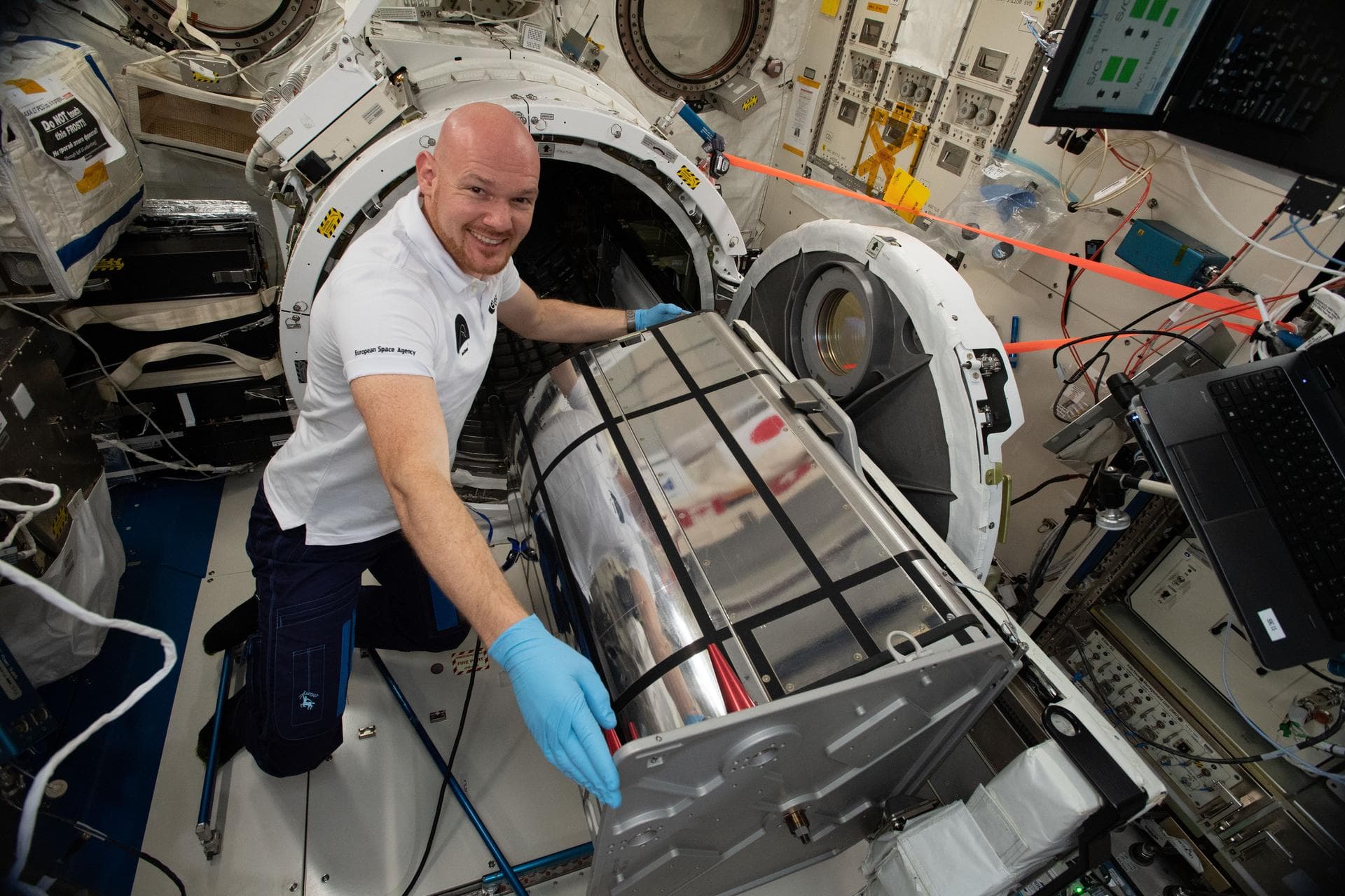 iss056e148119 (8/20/2018) --- Astronaut Alexander Gerst of ESA (European Space Agency) prepares the German Space Agency (DLR) Earth Sensing Imaging Spectrometer (DESIS) investigation for installation.