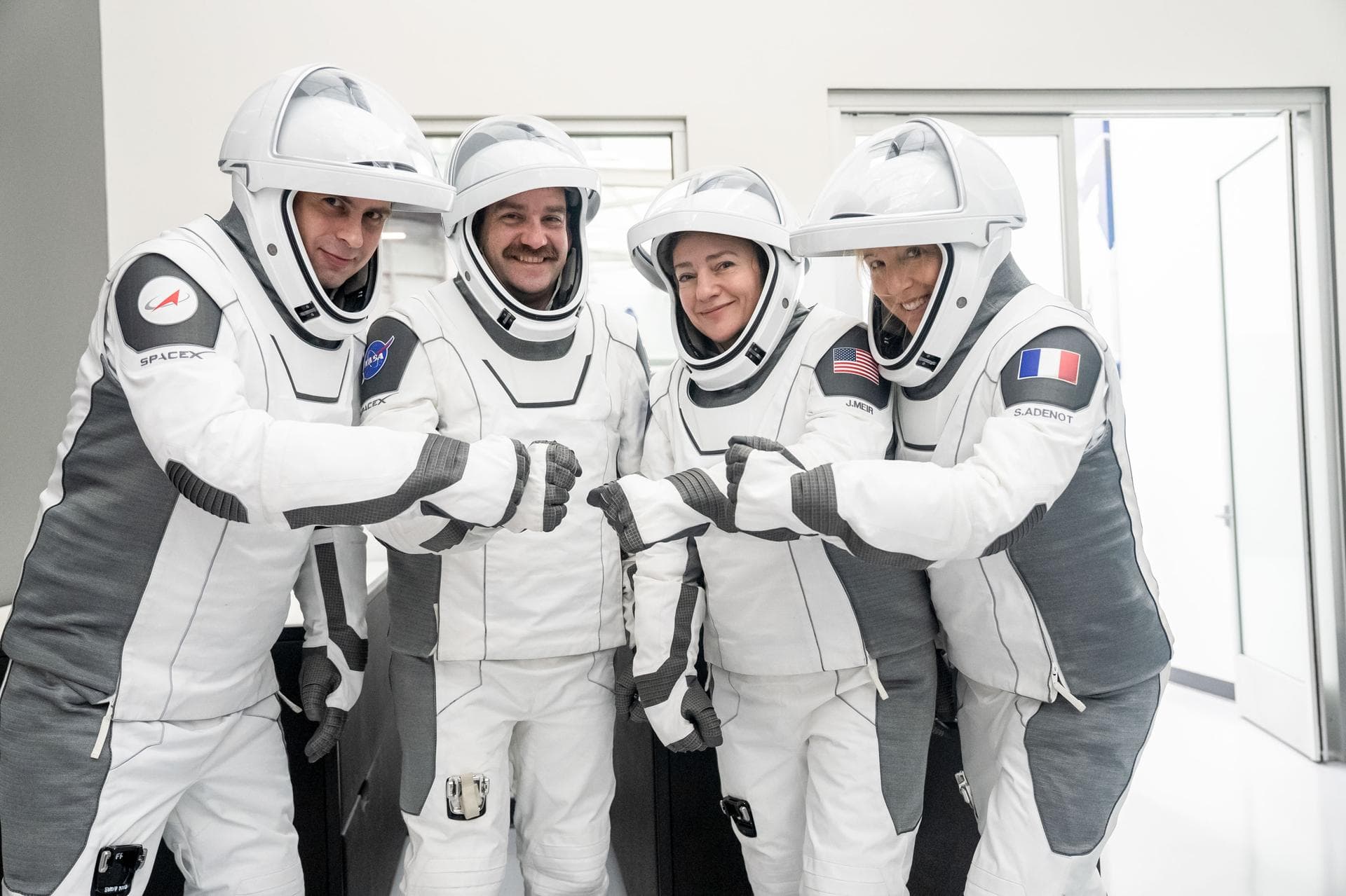 jsc2026e004026 (Jan. 21, 2026) --- The four members of NASA's SpaceX Crew-12 mission to the International Space Station pose together for a crew portrait in their pressure suits at SpaceX headquarters