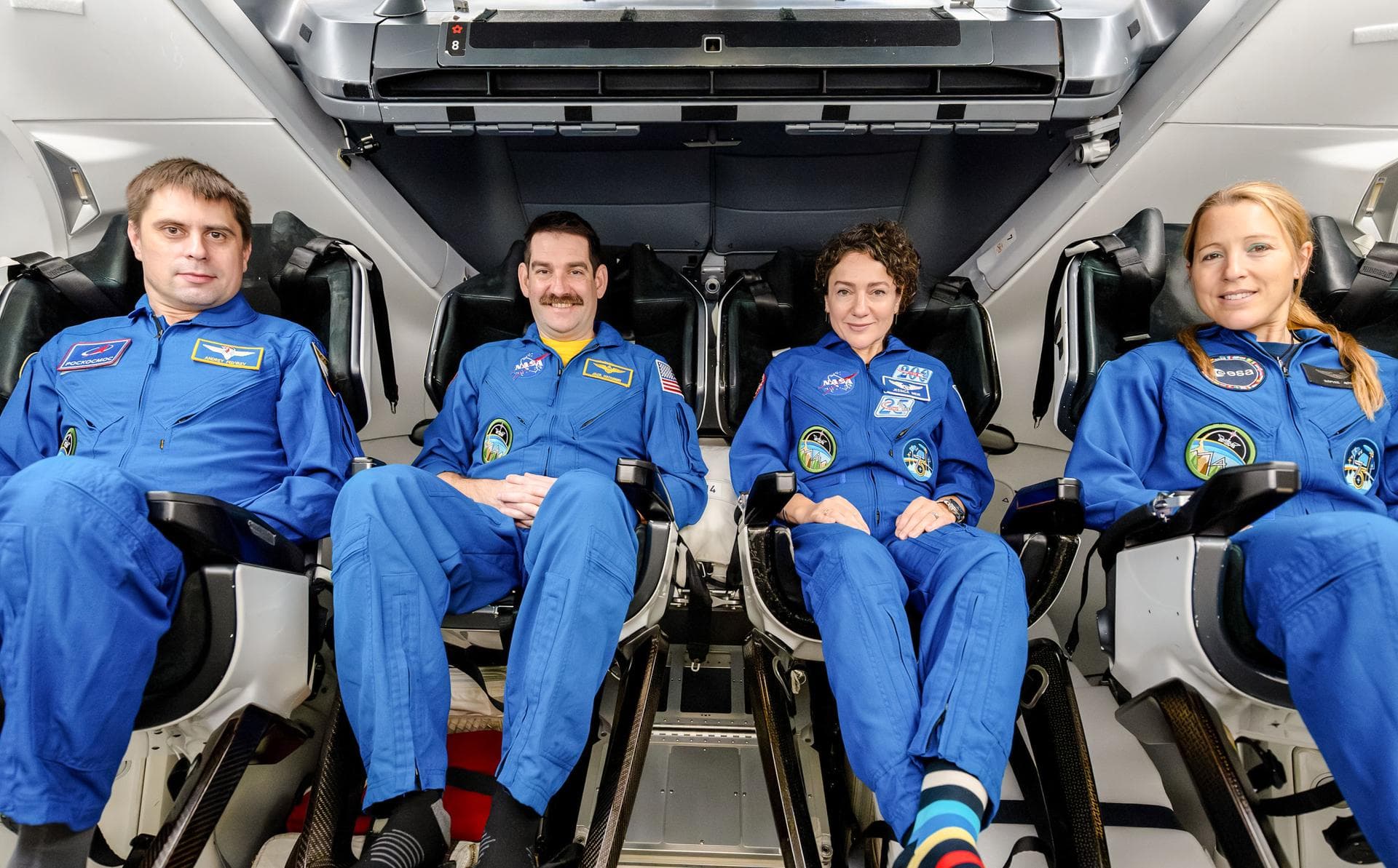 jsc2026e004027 (Jan. 23, 2026) --- The four members of NASA's SpaceX Crew-12 mission to the International Space Station pose together for a crew portrait inside a SpaceX Dragon spacecraft at SpaceX he