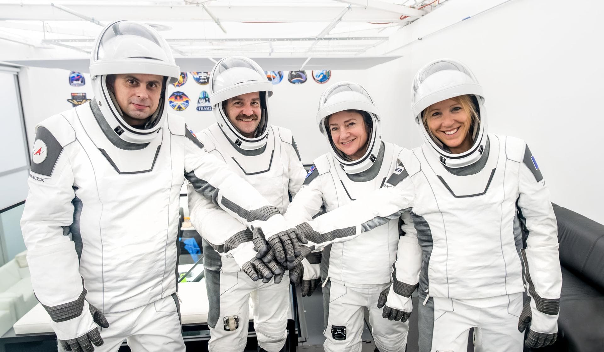 jsc2026e004031 (Jan. 23, 2026) --- The four members of NASA's SpaceX Crew-12 mission to the International Space Station pose together for a crew portrait in their pressure suits at SpaceX headquarters