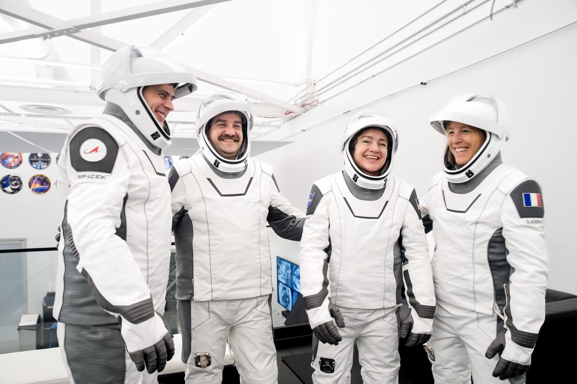 jsc2026e004033 (Jan. 21, 2026) --- The four members of NASA's SpaceX Crew-12 mission to the International Space Station pose together for a crew portrait in their pressure suits at SpaceX headquarters
