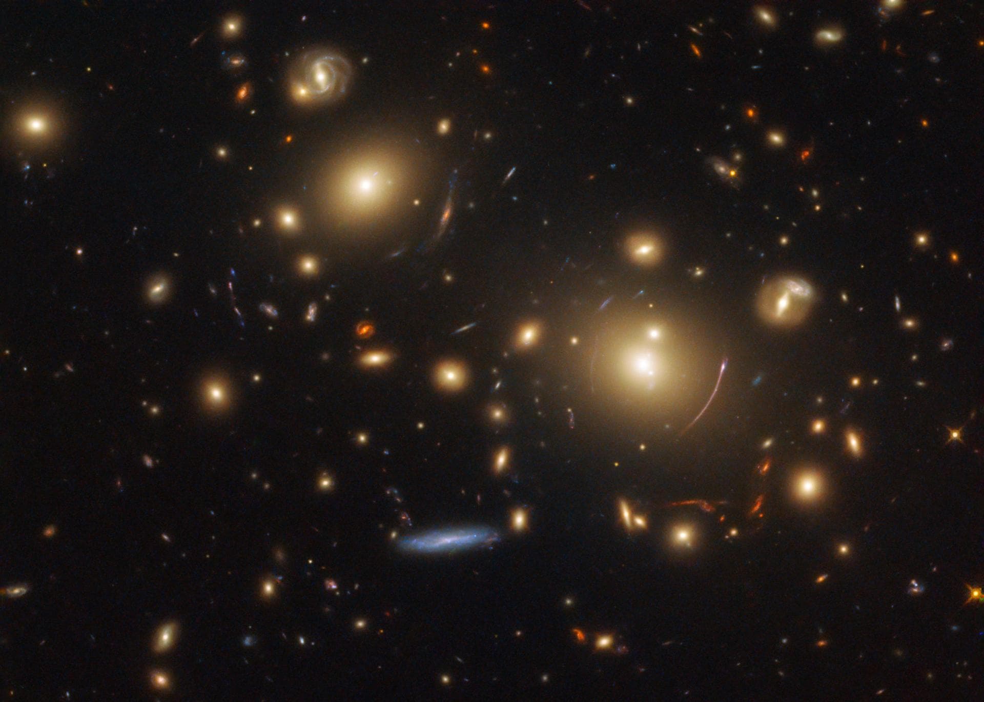 This picture showcases a gravitational lensing system called SDSS J0928+2031. Astronomers are using NASA/ESA Hubble Space Telescope observations of this type of lensing to research how stars form and