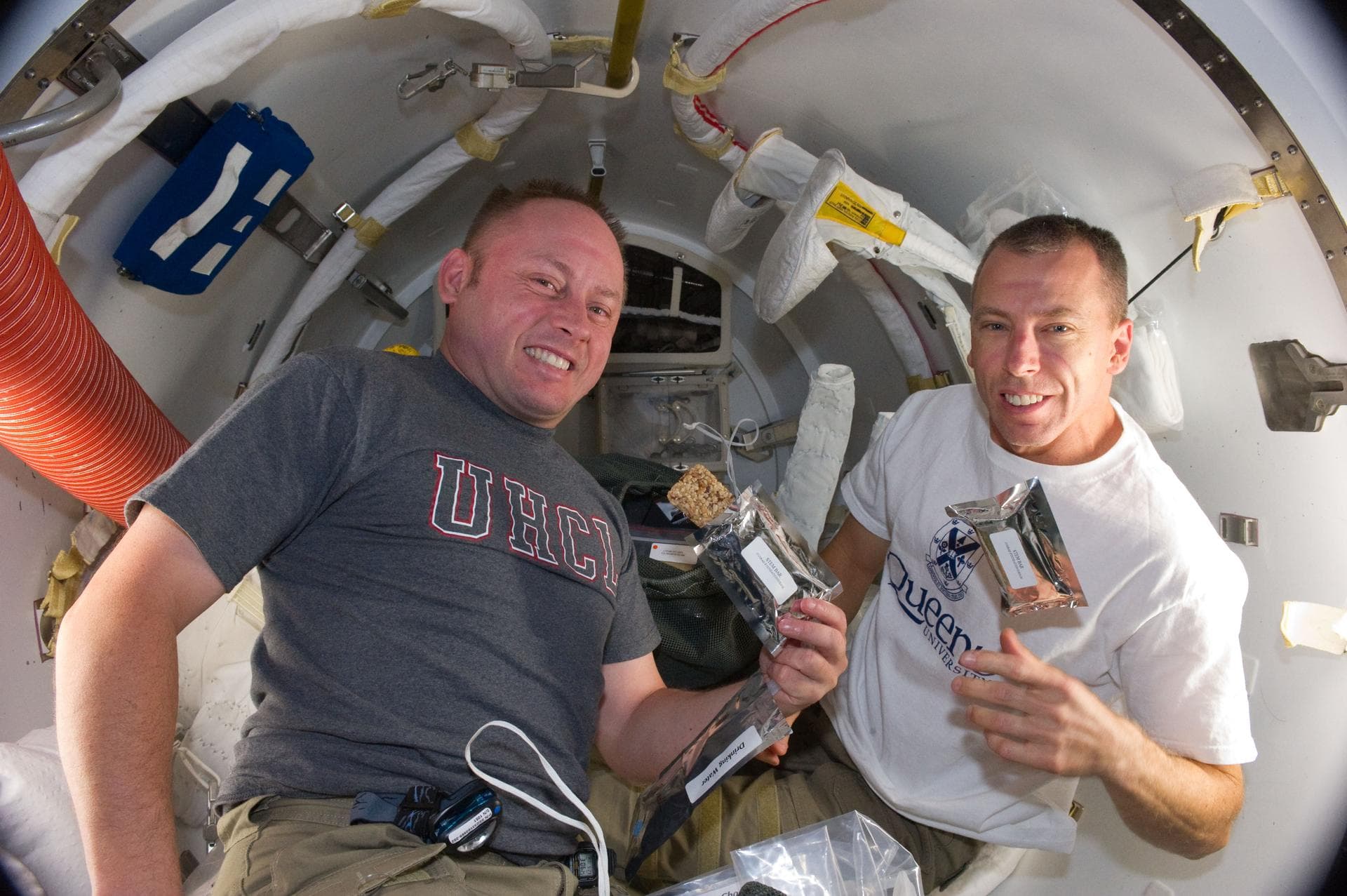 S134-E-008462 (22 May 2011) --- A short time before they donned their Extravehicular Mobility Unit spacesuits, NASA astronauts Michael Fincke (left) and Andrew Feustel, both STS-134 mission specialist