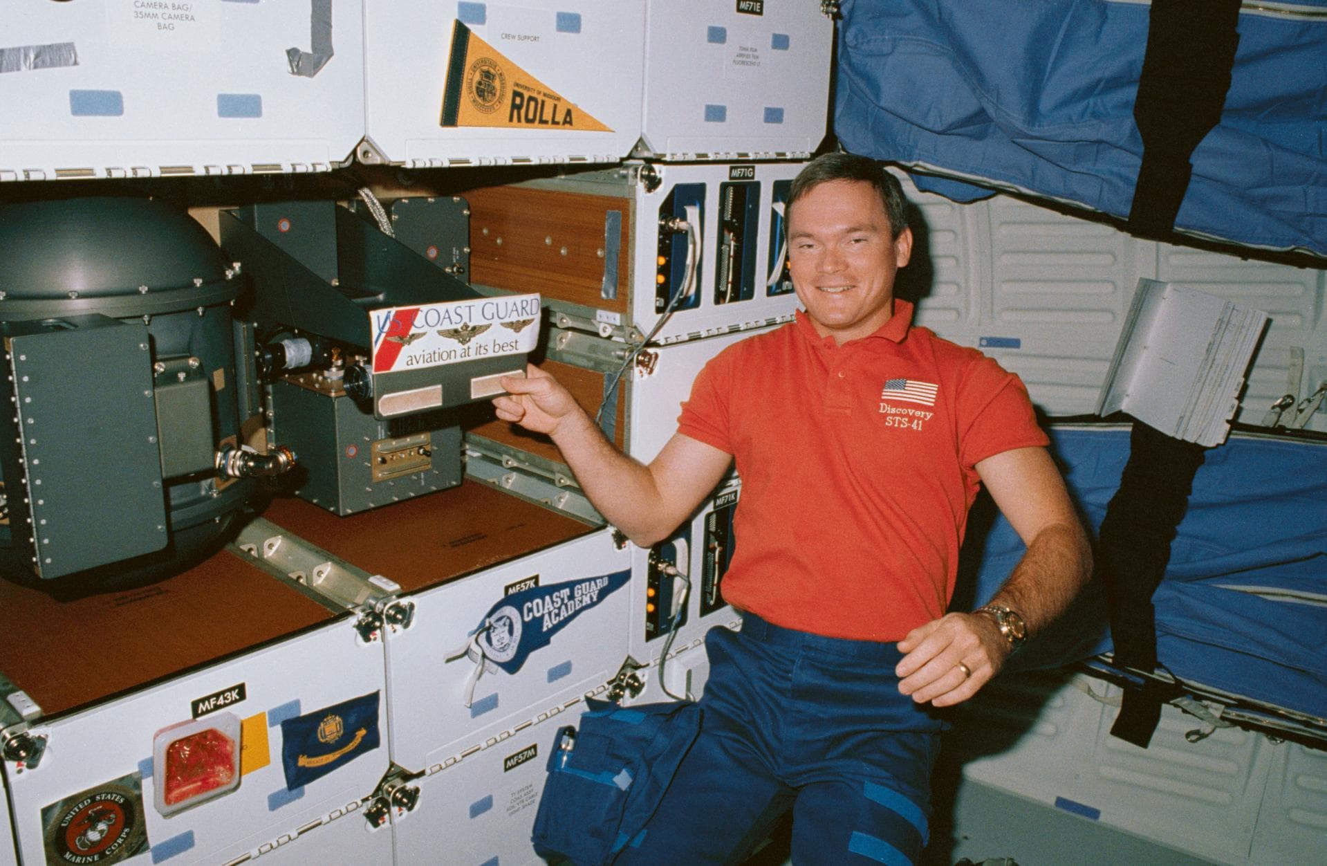 STS041-06-029 (10 Oct 1990) --- STS-41 Mission Specialist (MS) Bruce E. Melnick, who is a graduate of the Coast Guard Academy and the first ever active Coast Guardsman to fly in space, draws attention